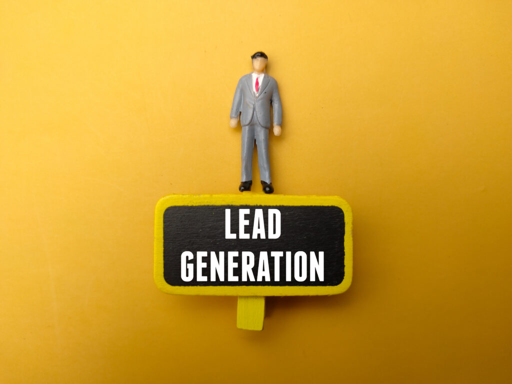 A miniature figure stands above a sign, highlighting lead generation strategies for steady growth.