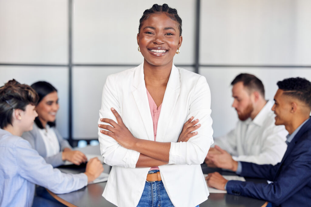Confident professional demonstrating good leadership skills during a collaborative team meeting.